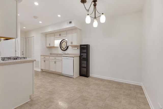 735 Wellington Ave, Elk Grove Village, IL 60007 - kitchen featuring white appliances, light countertops, white cabinets, pendant lighting, and recessed lighting