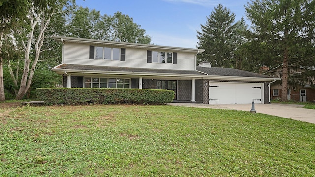 5809 Inverness Dr, Rockford, IL 61107 - traditional home featuring driveway, an attached garage, and a front yard