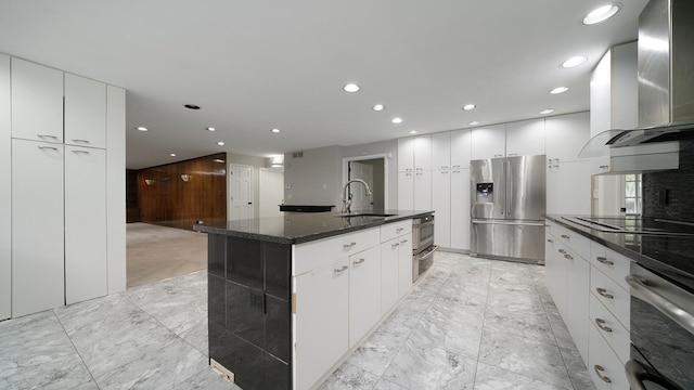5809 Inverness Dr, Rockford, IL 61107 - kitchen featuring stainless steel fridge, light marble finish floors, range hood, black electric stovetop, and recessed lighting