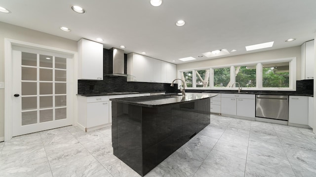 5809 Inverness Dr, Rockford, IL 61107 - kitchen featuring wall chimney exhaust hood, dishwasher, a skylight, decorative backsplash, and recessed lighting