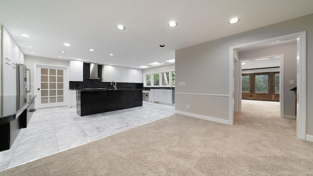 5809 Inverness Dr, Rockford, IL 61107 - kitchen with wall chimney range hood, light carpet, recessed lighting, white cabinets, and french doors