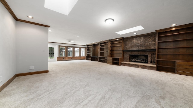 5809 Inverness Dr, Rockford, IL 61107 - unfurnished living room featuring a skylight, recessed lighting, a fireplace, built in shelves, and ornamental molding