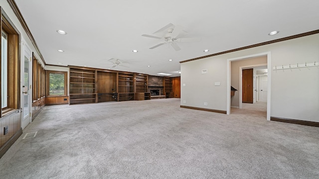 5809 Inverness Dr, Rockford, IL 61107 - unfurnished living room with ceiling fan, crown molding, a fireplace, light colored carpet, and recessed lighting