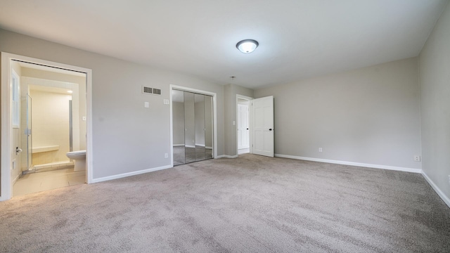 5809 Inverness Dr, Rockford, IL 61107 - unfurnished bedroom with carpet flooring, a closet, and ensuite bathroom