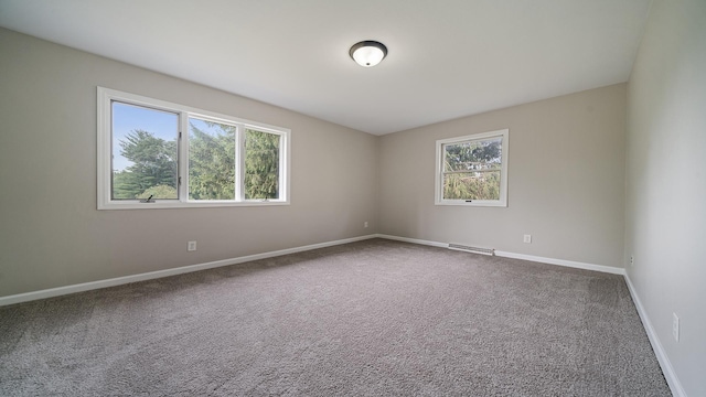 5809 Inverness Dr, Rockford, IL 61107 - carpeted spare room featuring baseboards