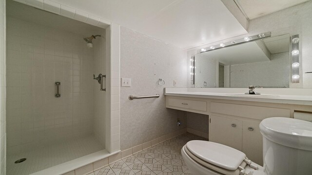 5809 Inverness Dr, Rockford, IL 61107 - bathroom featuring tile patterned flooring, tiled shower, and vanity