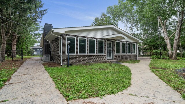 5809 Inverness Dr, Rockford, IL 61107 - back of property featuring a chimney and brick siding