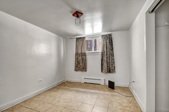 3241 S 53rd Ct, Cicero, IL 60804 - unfurnished room with a baseboard heating unit and tile patterned floors