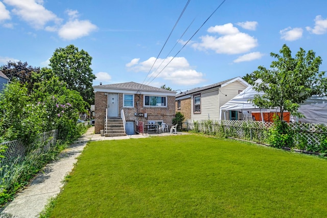 3241 S 53rd Ct, Cicero, IL 60804 - back of house with brick siding and a fenced backyard
