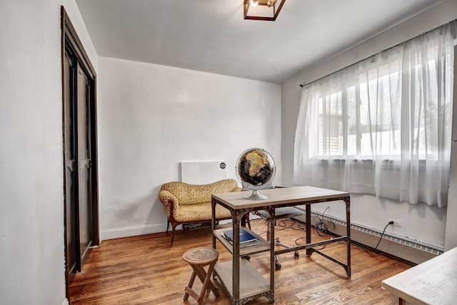 3241 S 53rd Ct, Cicero, IL 60804 - office space featuring a baseboard heating unit and wood finished floors
