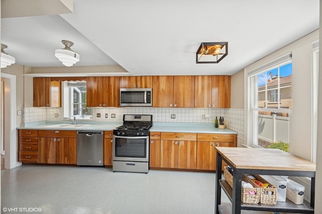 1300 Highridge Pkwy, Westchester, IL 60154 - kitchen with appliances with stainless steel finishes, brown cabinetry, and light countertops