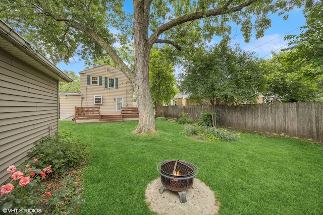 1300 Highridge Pkwy, Westchester, IL 60154 - fenced yard with an outdoor fire pit and a wooden deck