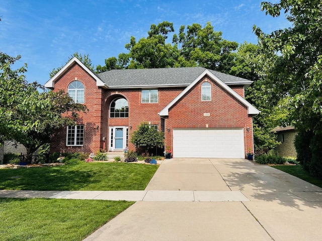 1448 Chestnut Xing, Lemont, IL 60439 - view of front facade with driveway, a front lawn, an attached garage, and brick siding