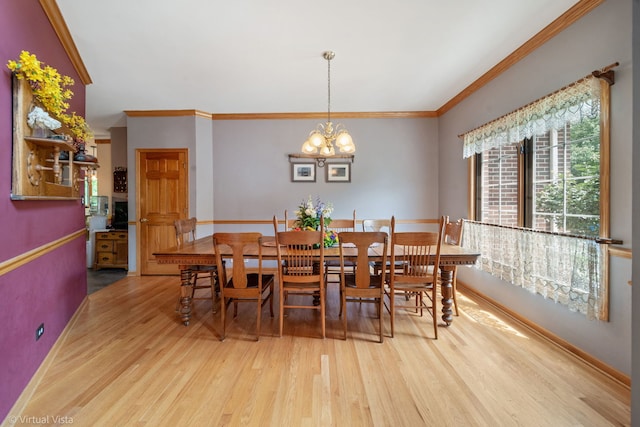 1448 Chestnut Xing, Lemont, IL 60439 - dining area featuring wood finished floors, a chandelier, and ornamental molding