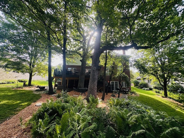 1448 Chestnut Xing, Lemont, IL 60439 - rear view of property with a deck and a lawn