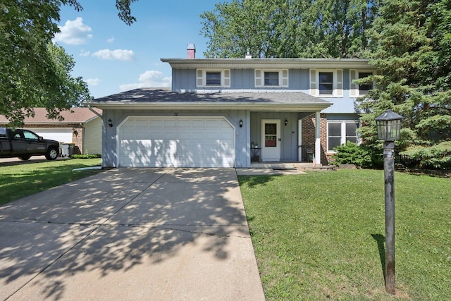 32 Woodridge Ln, Streamwood, IL 60107 - traditional-style house featuring a front lawn, driveway, a chimney, and an attached garage