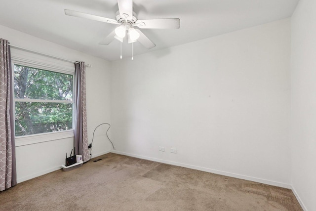 32 Woodridge Ln, Streamwood, IL 60107 - spare room featuring light carpet and a ceiling fan