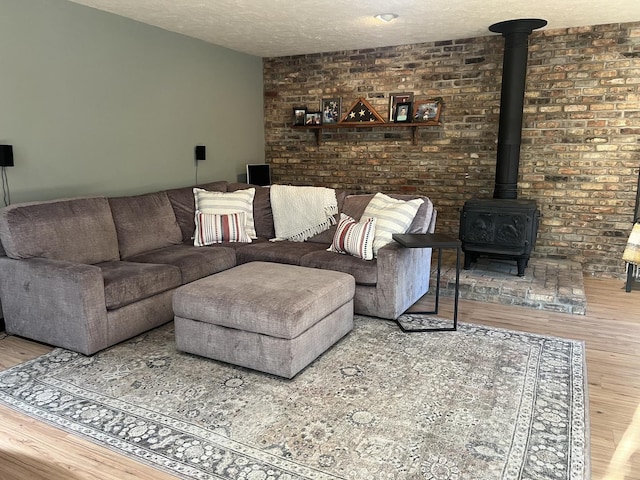 5 Knollcrest Ct, Normal, IL 61761 - living room with a wood stove, wood finished floors, and a textured ceiling