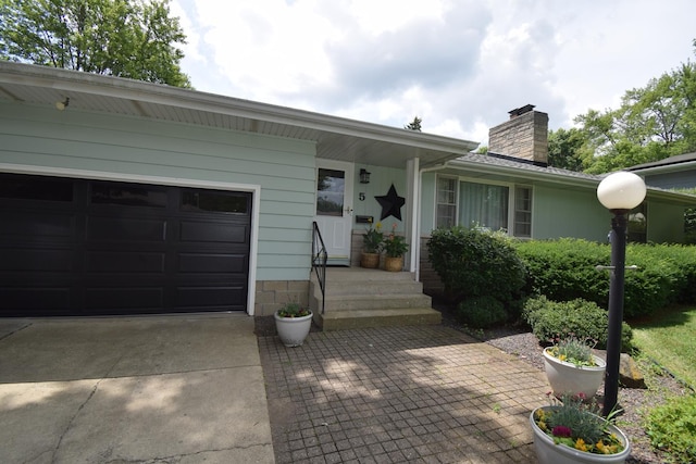 5 Knollcrest Ct, Normal, IL 61761 - ranch-style house featuring a chimney, driveway, and a garage