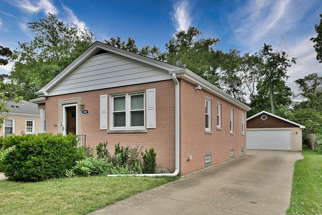 1747 Linneman St, Glenview, IL 60025 - view of front of house with an outdoor structure, brick siding, a garage, and a front yard