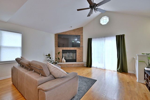 1747 Linneman St, Glenview, IL 60025 - living area featuring a ceiling fan, a fireplace, light wood-type flooring, and high vaulted ceiling