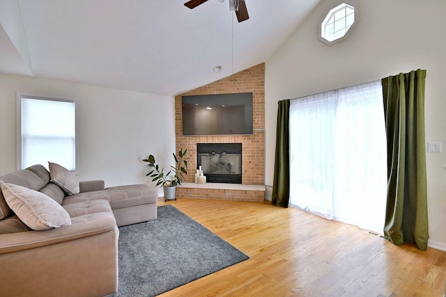 1747 Linneman St, Glenview, IL 60025 - living room with vaulted ceiling, a ceiling fan, wood finished floors, and a brick fireplace
