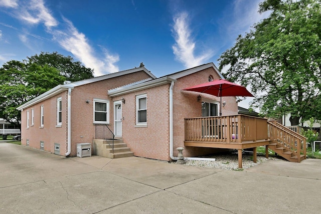 1747 Linneman St, Glenview, IL 60025 - view of front of property with a wooden deck and brick siding