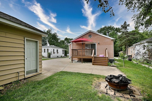 1747 Linneman St, Glenview, IL 60025 - rear view of property with an outdoor fire pit, a deck, a patio area, and a lawn