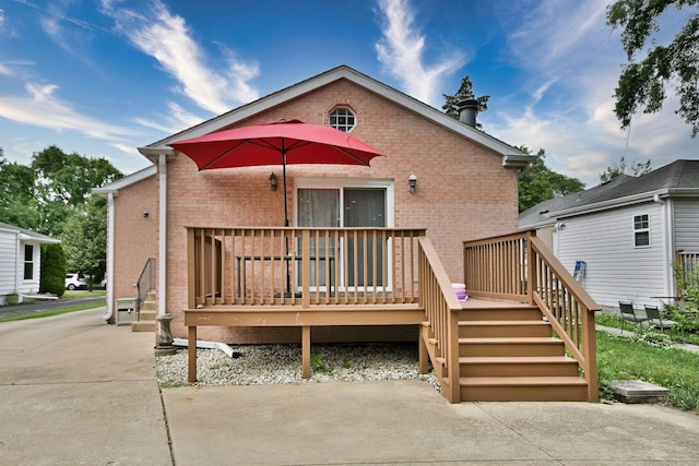 1747 Linneman St, Glenview, IL 60025 - back of house featuring brick siding, a deck, and stairs
