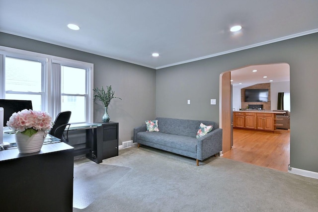 1747 Linneman St, Glenview, IL 60025 - living room with arched walkways, light colored carpet, recessed lighting, crown molding, and an office area