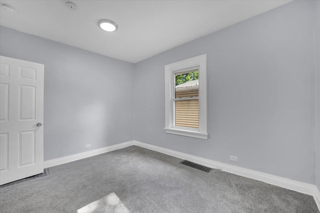 305 S Lewis Ave, Waukegan, IL 60085 - carpeted empty room with a smoke detector and baseboards