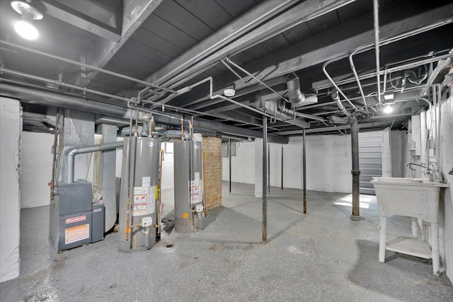 305 S Lewis Ave, Waukegan, IL 60085 - unfinished basement featuring water heater and heating unit