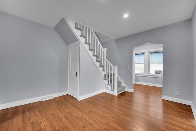 305 S Lewis Ave, Waukegan, IL 60085 - unfurnished living room with stairs and wood finished floors