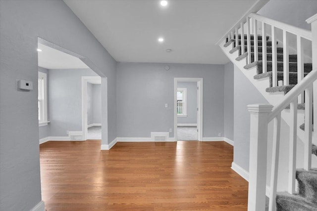 305 S Lewis Ave, Waukegan, IL 60085 - entryway with arched walkways, wood finished floors, stairway, and recessed lighting