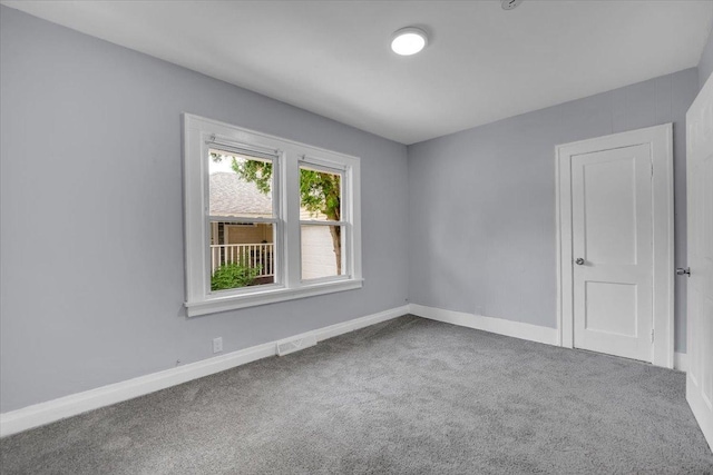 305 S Lewis Ave, Waukegan, IL 60085 - carpeted empty room featuring baseboards