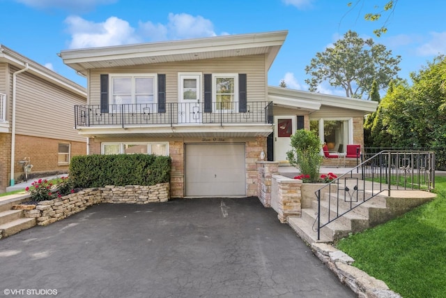 506 S Charleton St, Willow Springs, IL 60480 - view of front facade featuring driveway, stone siding, and a garage