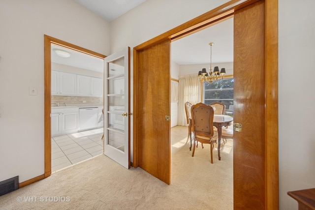 506 S Charleton St, Willow Springs, IL 60480 - corridor with a chandelier, light colored carpet, and light tile patterned floors