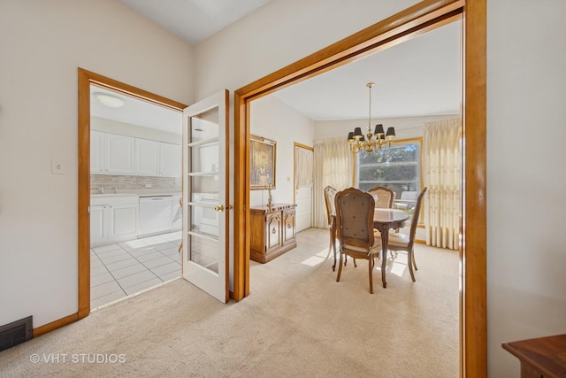 506 S Charleton St, Willow Springs, IL 60480 - dining area with a chandelier and light colored carpet