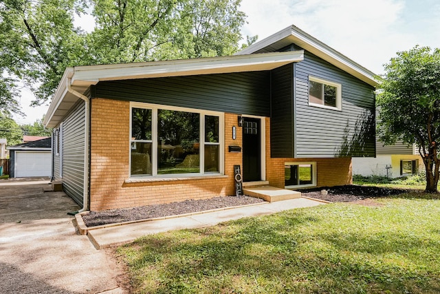 570 Dawes Ave, Glen Ellyn, IL 60137 - tri-level home with a front yard, brick siding, and an outbuilding