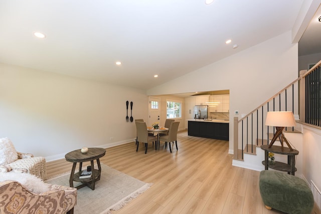 570 Dawes Ave, Glen Ellyn, IL 60137 - living room featuring stairway, recessed lighting, light wood-style floors, and vaulted ceiling
