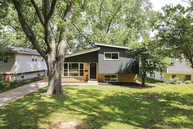 570 Dawes Ave, Glen Ellyn, IL 60137 - view of front facade featuring a front lawn, entry steps, brick siding, and driveway