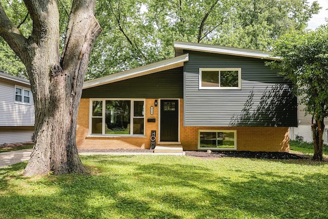 570 Dawes Ave, Glen Ellyn, IL 60137 - tri-level home featuring a front lawn, brick siding, and entry steps