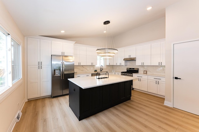 570 Dawes Ave, Glen Ellyn, IL 60137 - kitchen with appliances with stainless steel finishes, lofted ceiling, tasteful backsplash, white cabinets, and recessed lighting