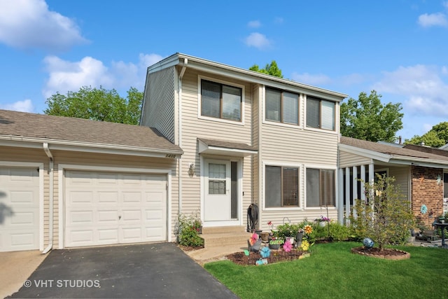 1410 N Whispering Springs Cir, Palatine, IL 60074 - view of property featuring asphalt driveway, a front lawn, and a garage