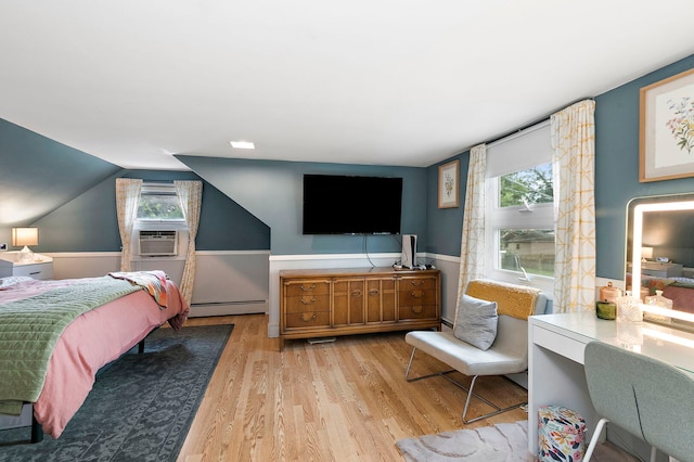 49 Burton Ave, Cary, IL 60013 - bedroom with baseboard heating, cooling unit, multiple windows, wood finished floors, and lofted ceiling