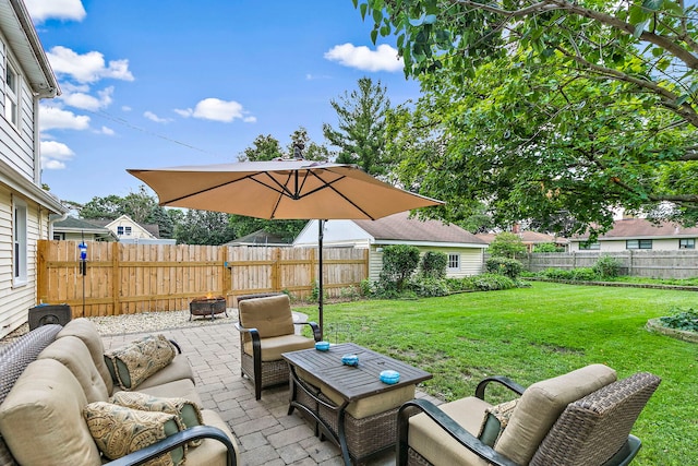 49 Burton Ave, Cary, IL 60013 - fenced backyard featuring a patio and an outdoor hangout area