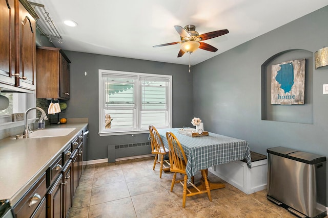 49 Burton Ave, Cary, IL 60013 - dining space with radiator, a ceiling fan, and light tile patterned flooring