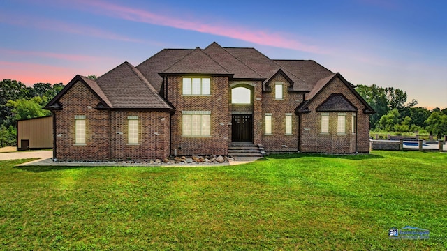 19113 Lauren Ln, Marengo, IL 60152 - french country style house with a front yard and brick siding