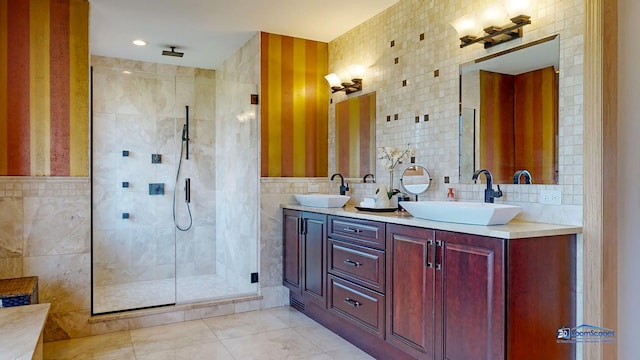 19113 Lauren Ln, Marengo, IL 60152 - bathroom featuring tile walls, a shower stall, double vanity, and tile patterned flooring