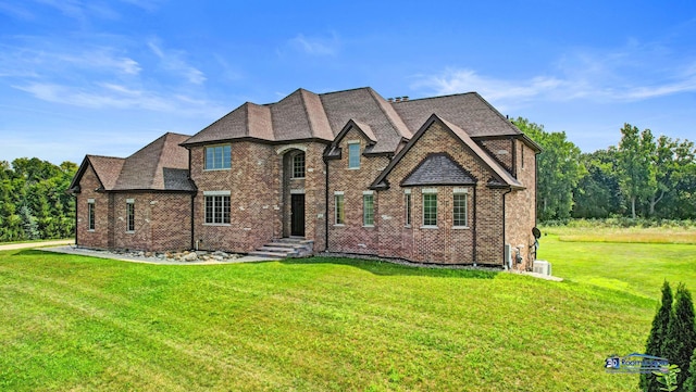 19113 Lauren Ln, Marengo, IL 60152 - french country inspired facade featuring a front lawn, brick siding, and roof with shingles